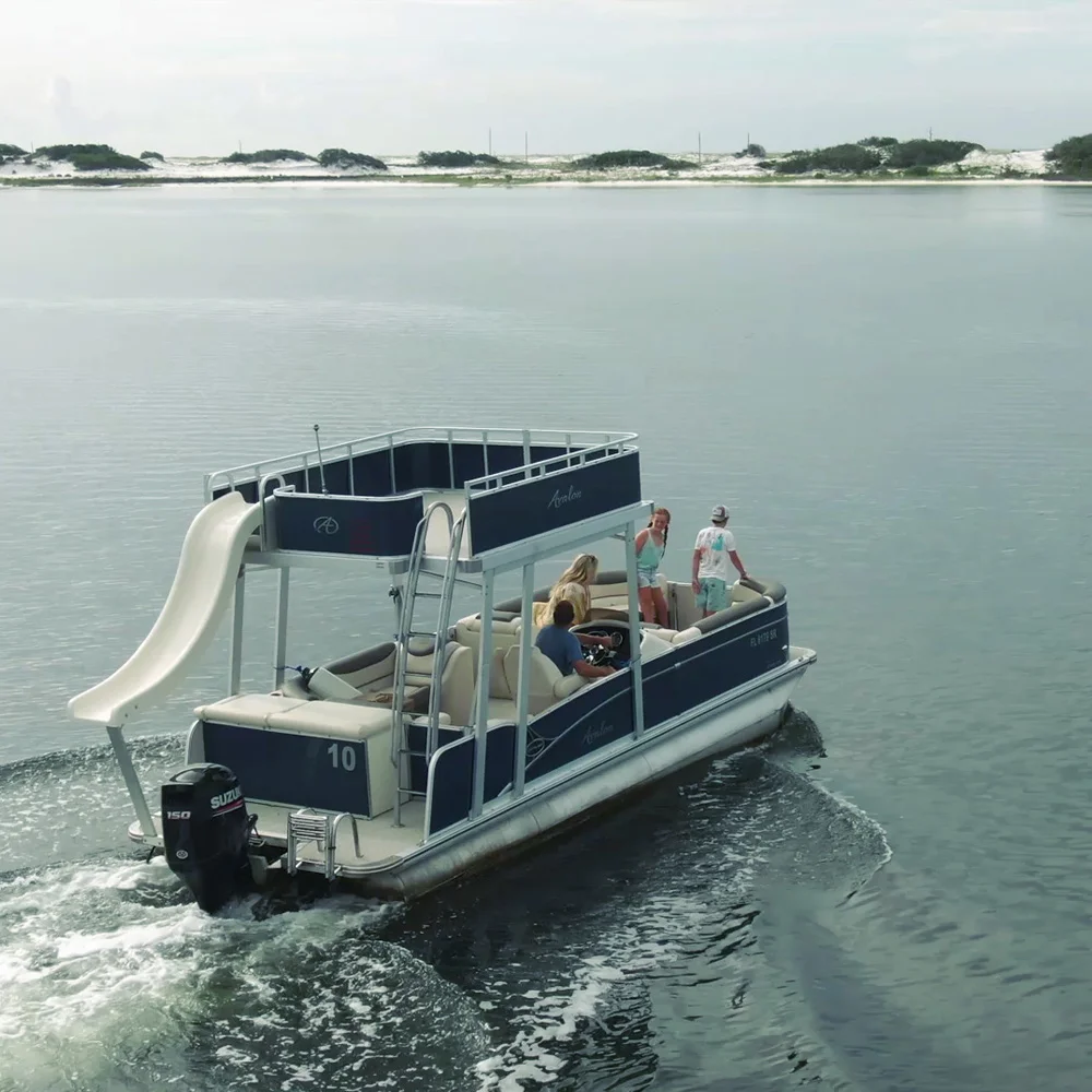 Double Decker pontoon ideling across the intercoastal waterway, kicking up foam in it's wake