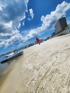 Private beach and paved parking at Navarre Family Watersports Adventure Complex